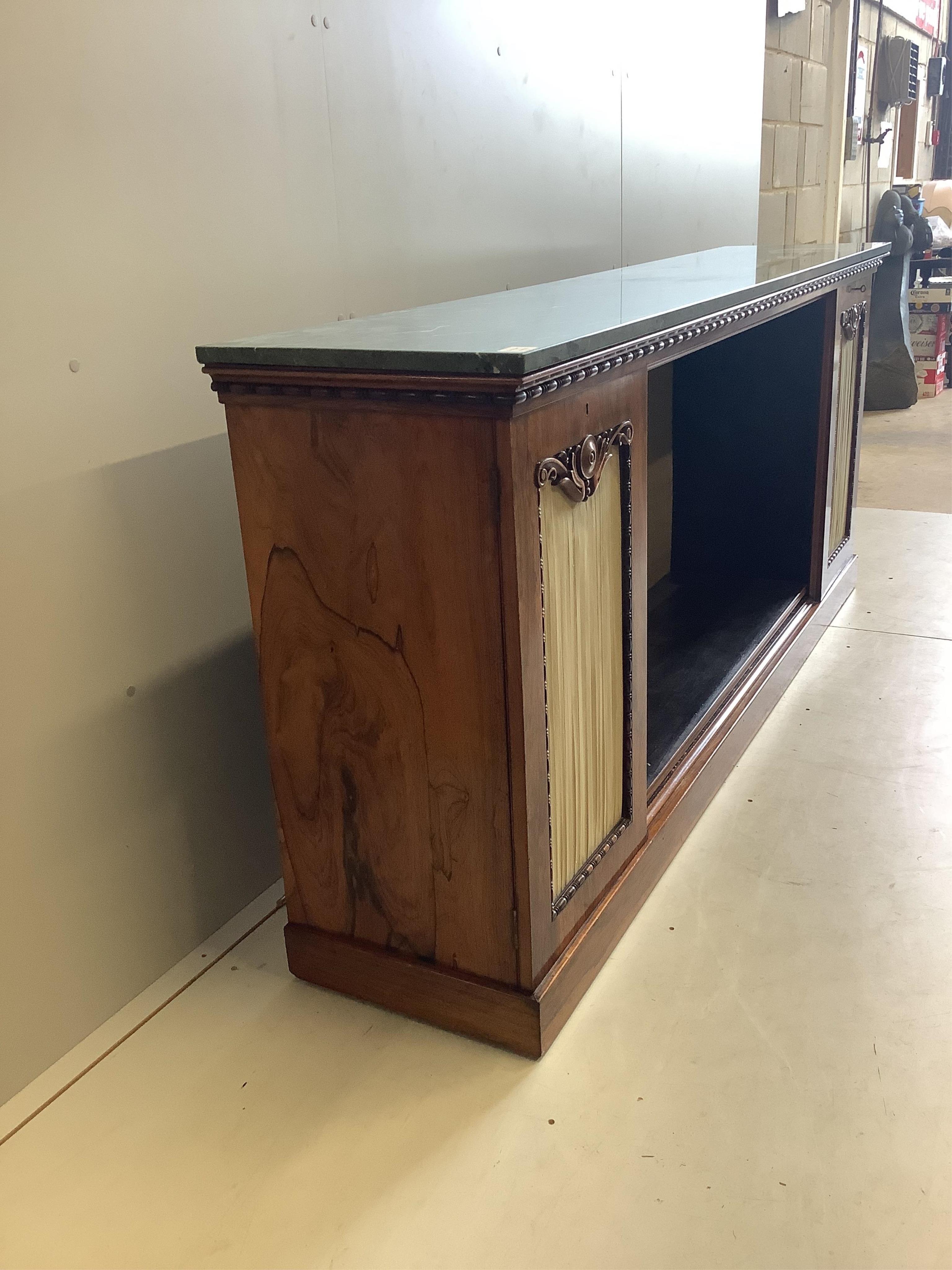 A William IV rosewood dwarf bookcase with associated marble top, width 213cm, depth 43cm, height 91cm. Condition - good